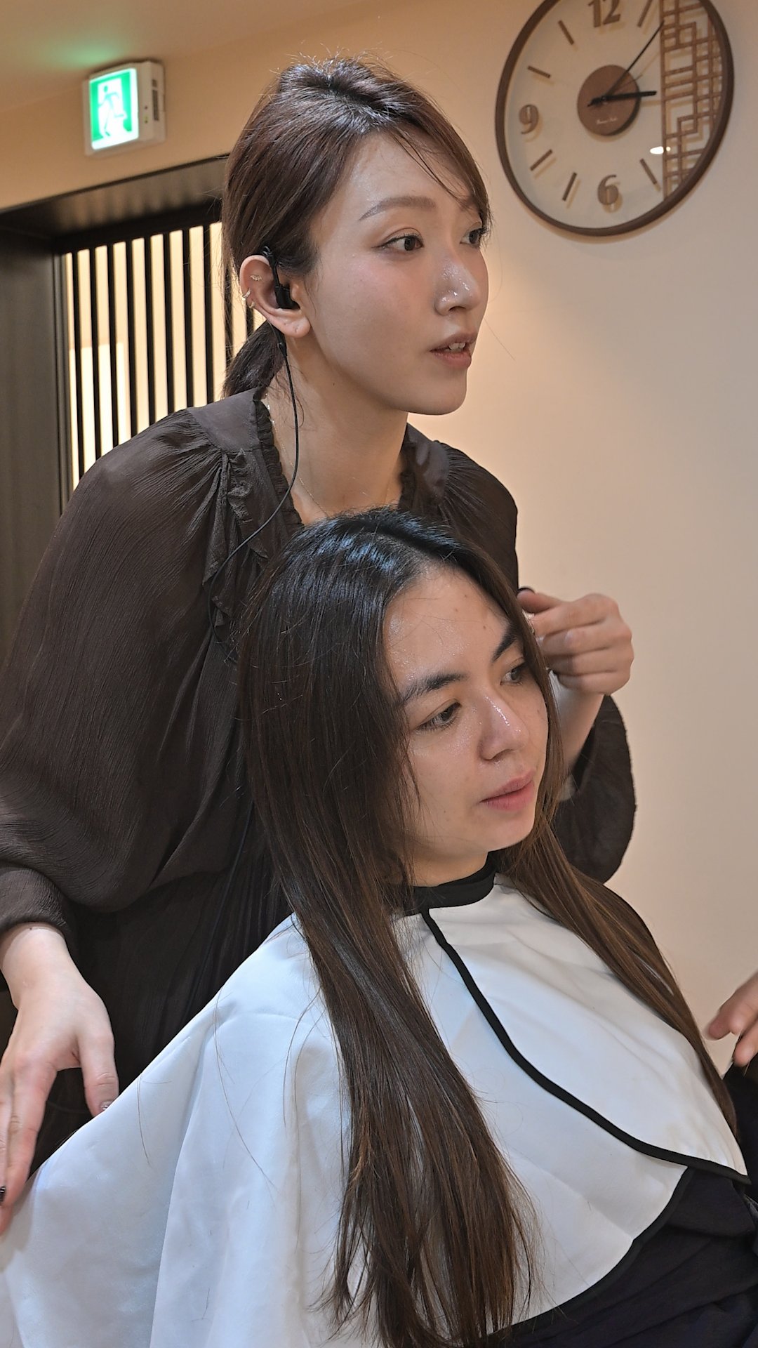 Hair designer consulting directly with an international guest in Cheongdam