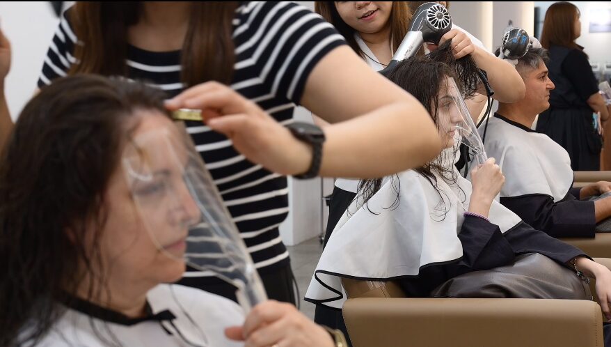 Parent and child receiving hair styling together at Parkjun Beautylab