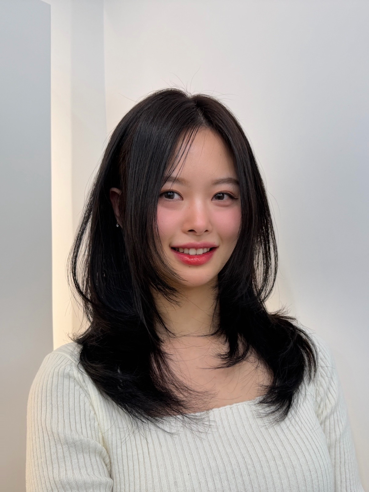 Medium-length Korean layered haircut with natural movement